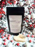 Peppermint & Berry Wax Melts in a package surrounded by festive berries and peppermint candies.