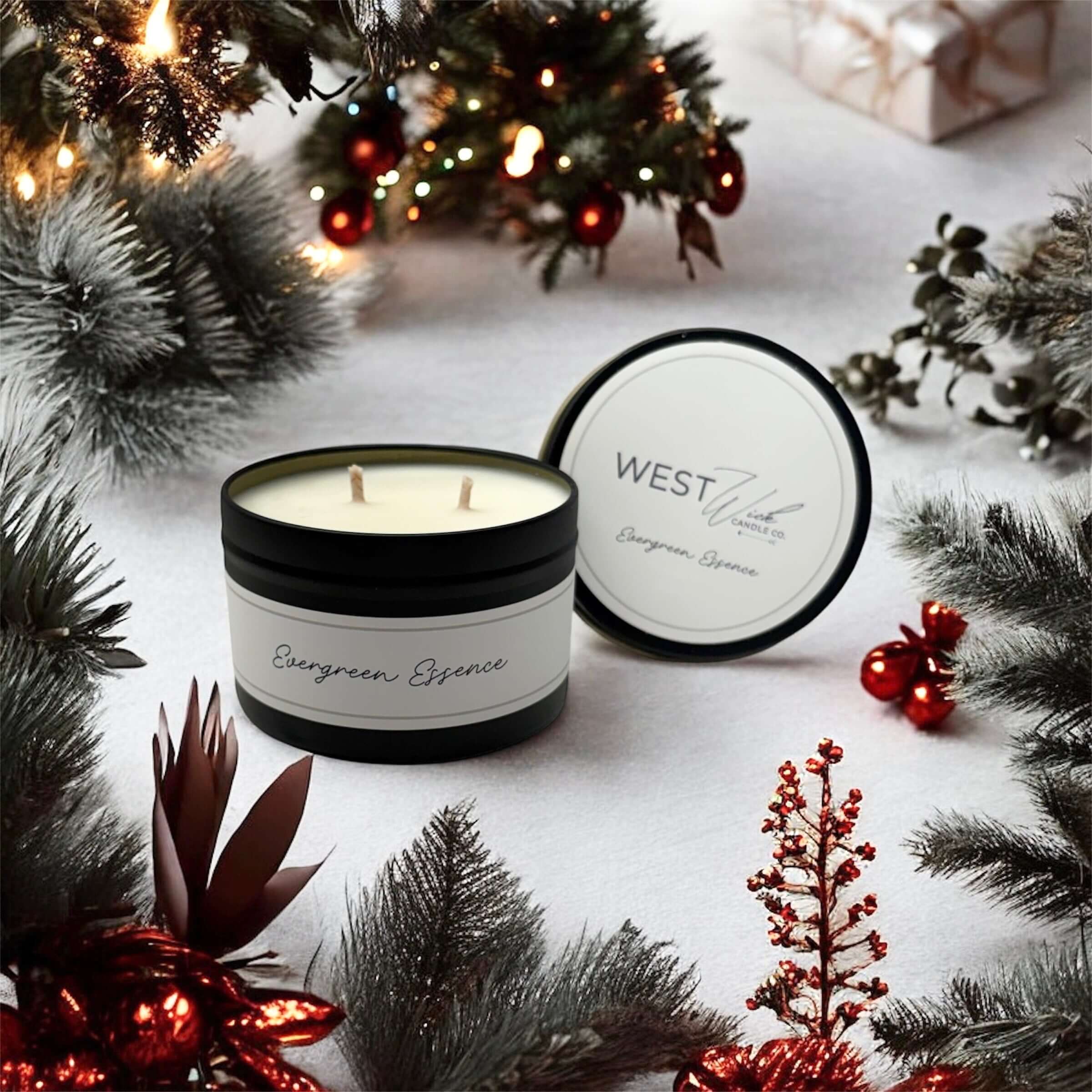 Evergreen Essence - Black Luxe Candle surrounded by festive holiday decor and evergreen branches.